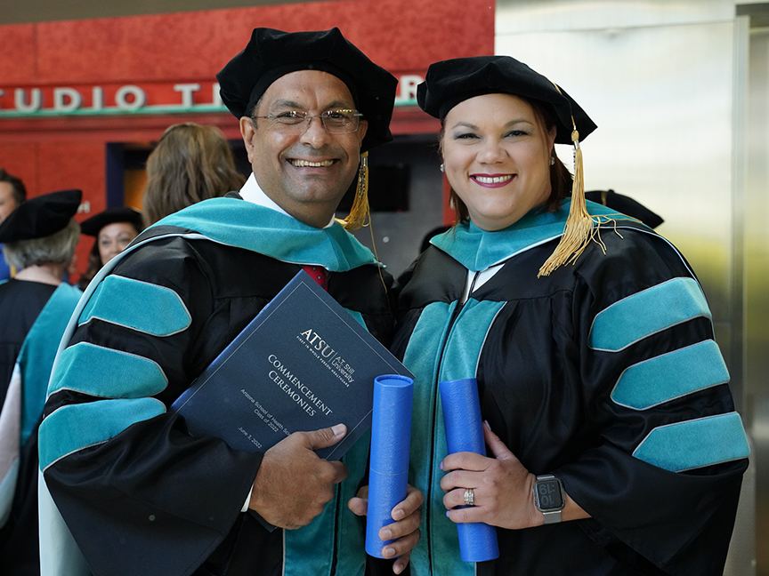 Two ATSU DPT graduates smiling for a photo together