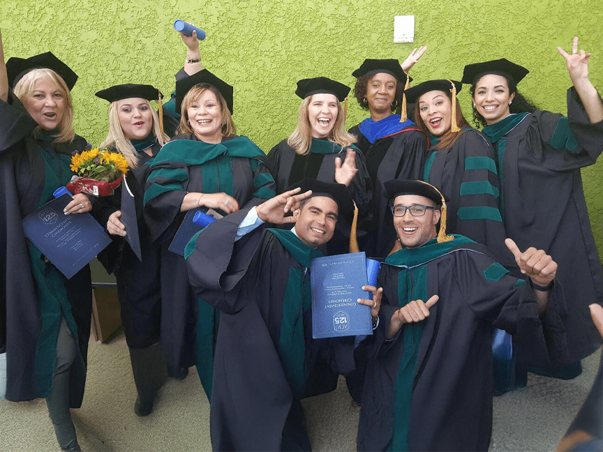 Group of ATSU DPT graduates smiling and posing for a photo