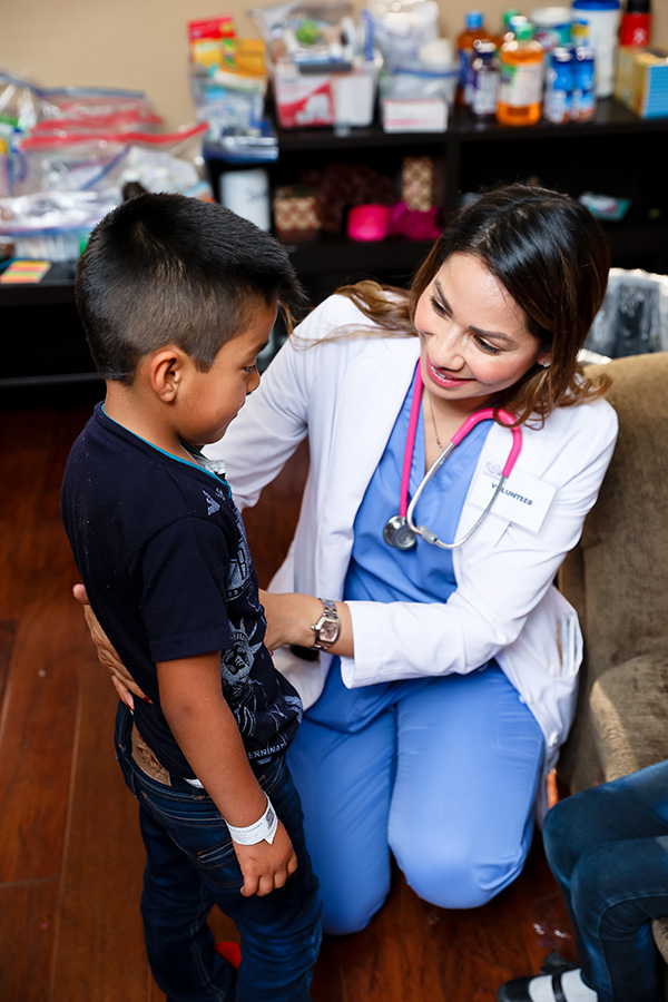 Physician assistant cares for young boy